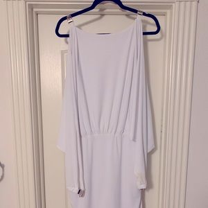 Women’s cold shoulder dress with gold chain detail.